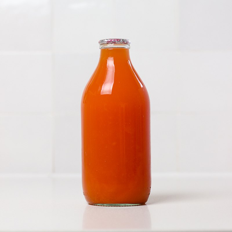 Pink grapefruit juice in a 1 pint glass bottle
